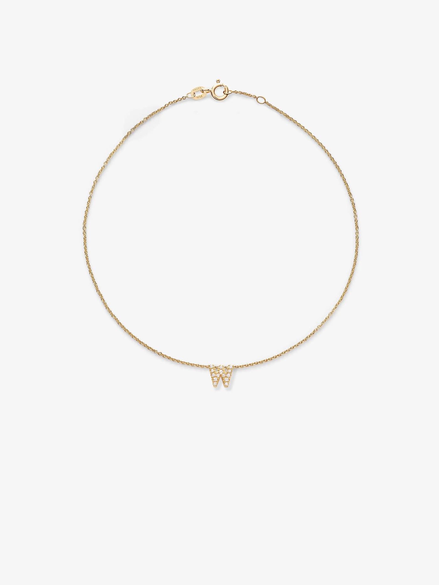 An image of a delicate bracelet in 18k solid gold featuring a thin chain and a small "W" pendant in the center. The "W" is adorned with tiny, round brilliant diamonds. The bracelet is arranged in a circular shape against a plain white background, showcasing the exquisite craftsmanship of the Letter W Bracelet in Diamonds and 18k Gold.