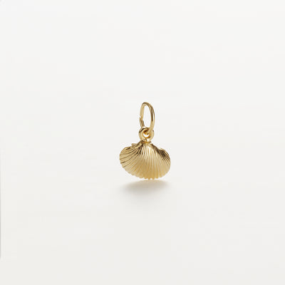 A Large Shell Charm in 9k Gold featuring intricate grooves and an oval loop, perfect for attaching to a necklace or bracelet. The pendant boasts a shiny, polished finish and is photographed against a plain white background.