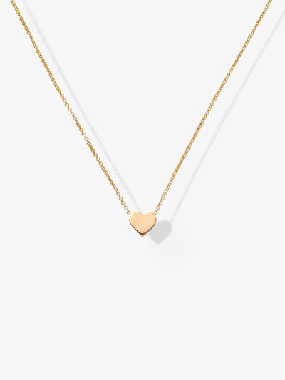 Miniature three-dimensional heart in 18-karat solid gold, thread onto an adjustable chain.