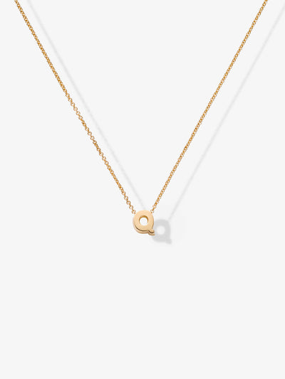 Introducing the "Letter Q Necklace in 18k Gold," a delicate 18k solid gold chain adorned with a small, elegant gold "Q" pendant. The necklace is showcased on a plain white background to emphasize its simple yet sophisticated design.