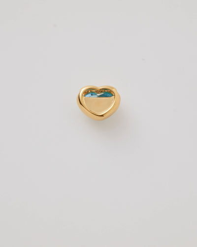 Small solid gold heart charm with a blue cabochon stone, designed to slide onto a necklace chain for a personalised jewellery piece.