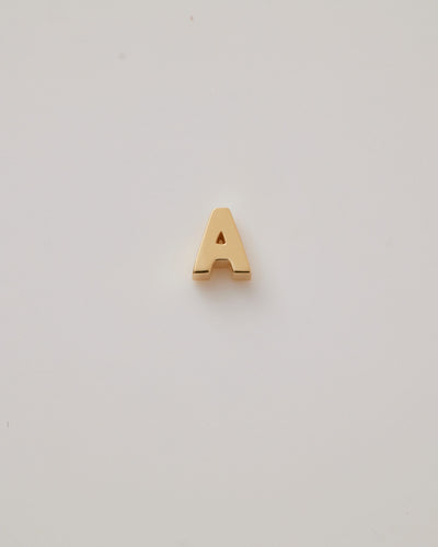 Small gold polished three-dimensional letter 'A' charm with a smooth finish, designed to thread onto a necklace chain.