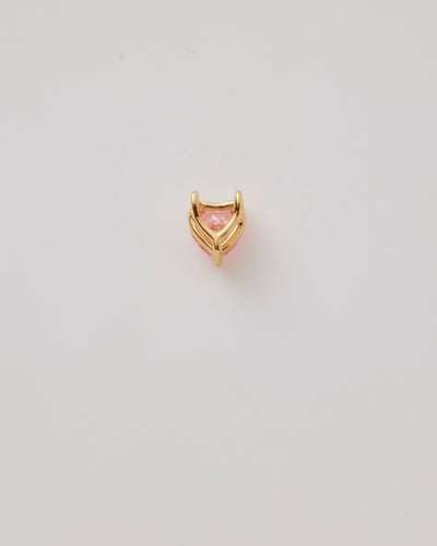Small solid gold pink heart charm, designed to slide onto a necklace chain for a personalised jewellery piece.