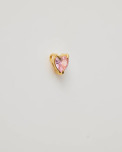 Small solid gold pink heart charm, designed to slide onto a necklace chain for a personalised jewellery piece.