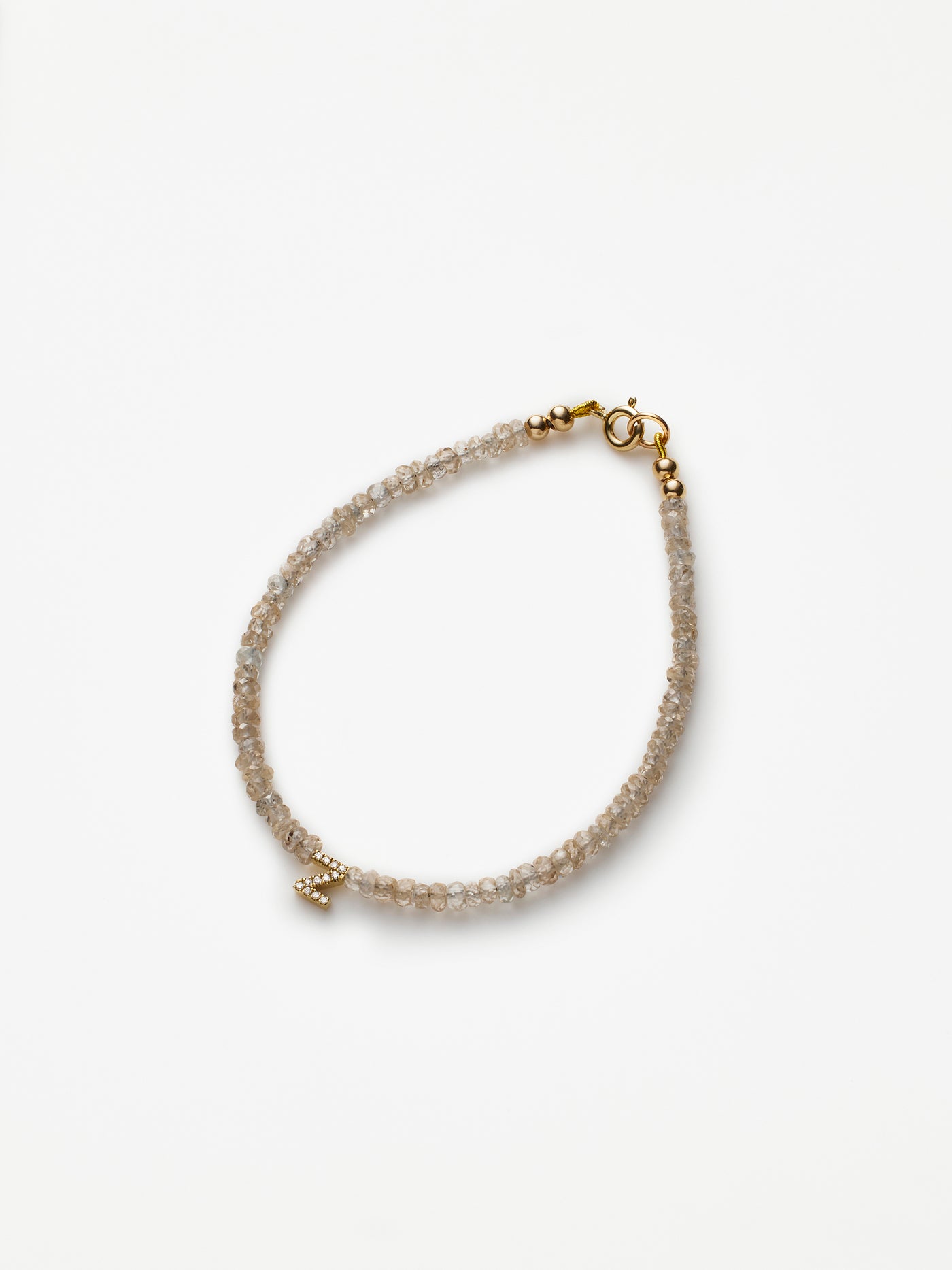 Hand-strung bracelet with natural natural zircon gemstones and miniature three-dimensional diamond letter in 18k solid gold